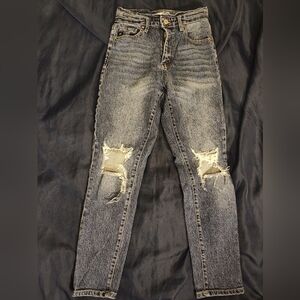 High-waisted distressed jeans